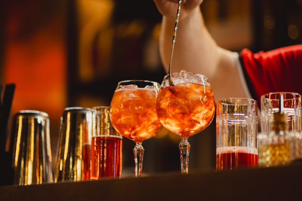 aperol-spritz-being-prepared-by-bartender